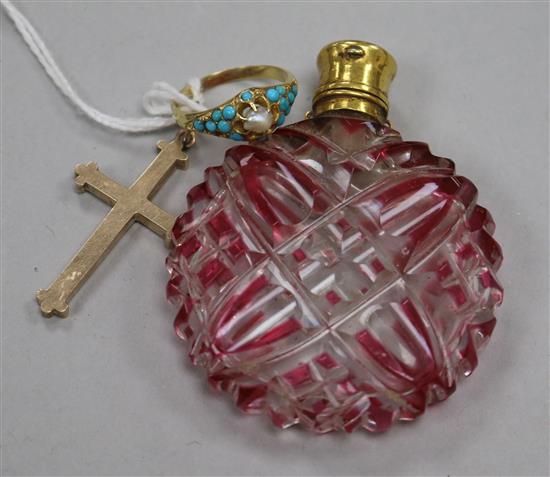 A 19th century yellow metal mounted ruby overlaid glass scent bottle, a yellow metal turquoise and seed pearl ring and a cross.